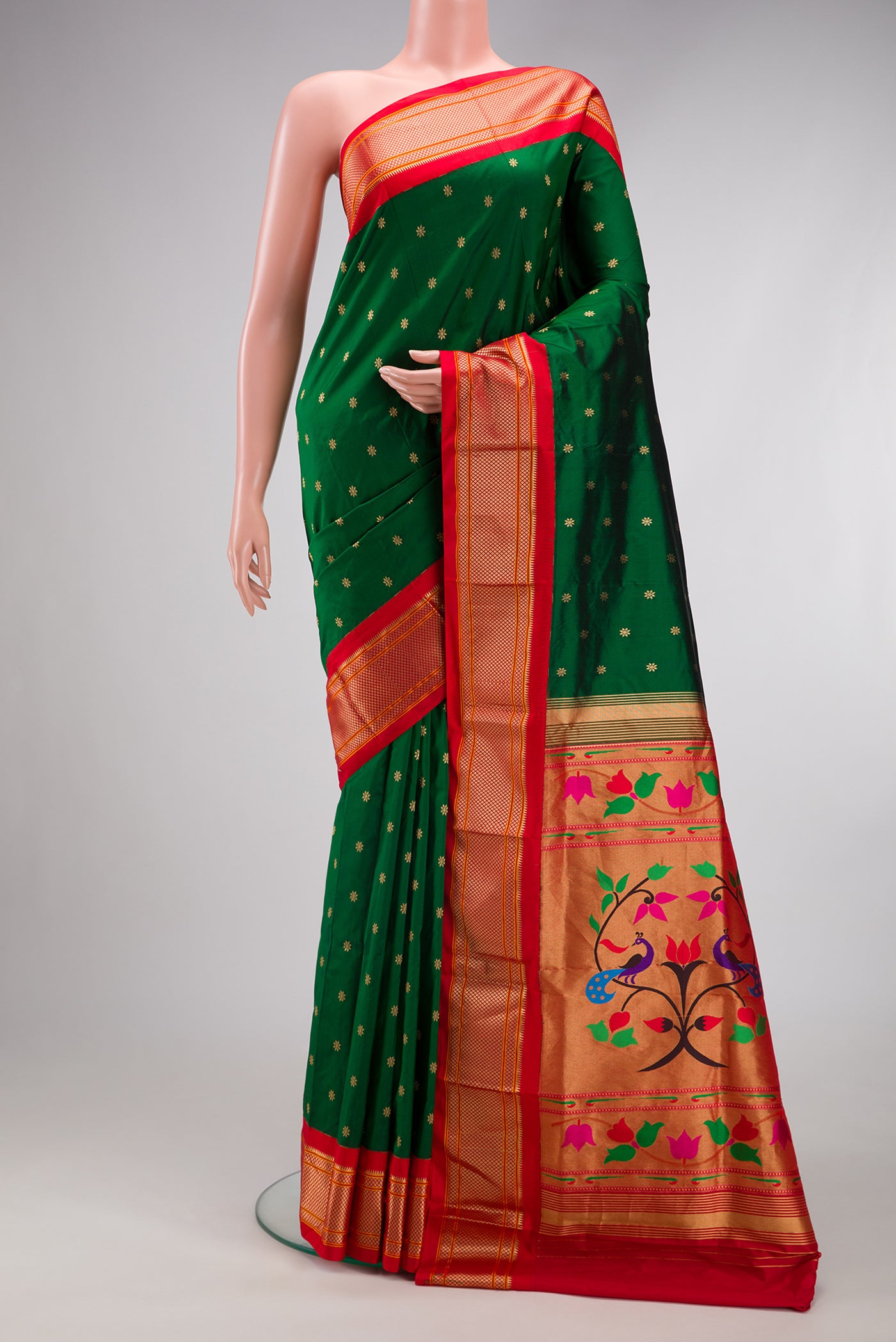 Bottle Green Paithani Silk Saree with Zari Butta on the body and Zari Border.  displayed on a mannequin