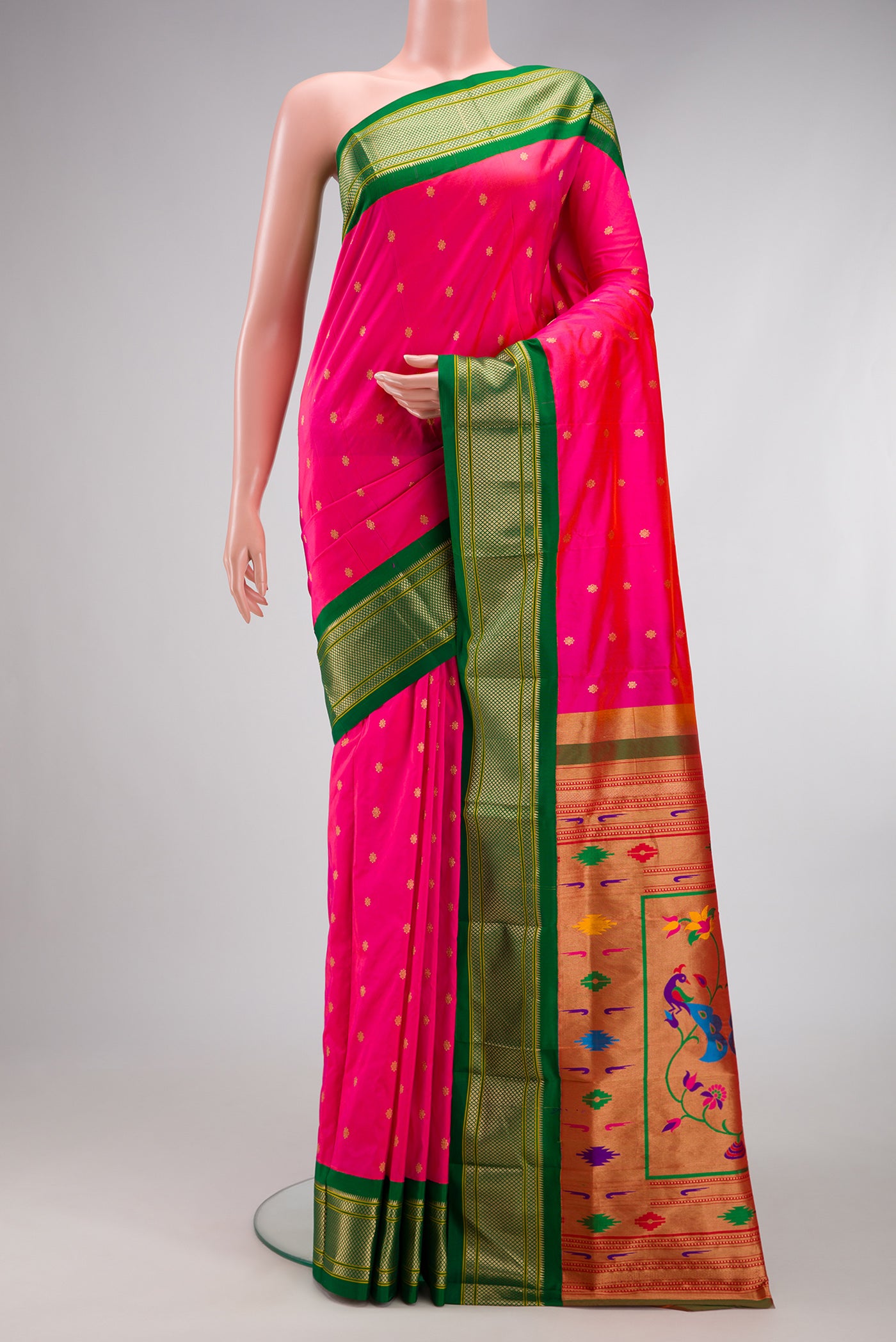 Dark Pink Paithani Silk Saree with Zari Butta on the body and Zari Border.  displayed on a mannequin
