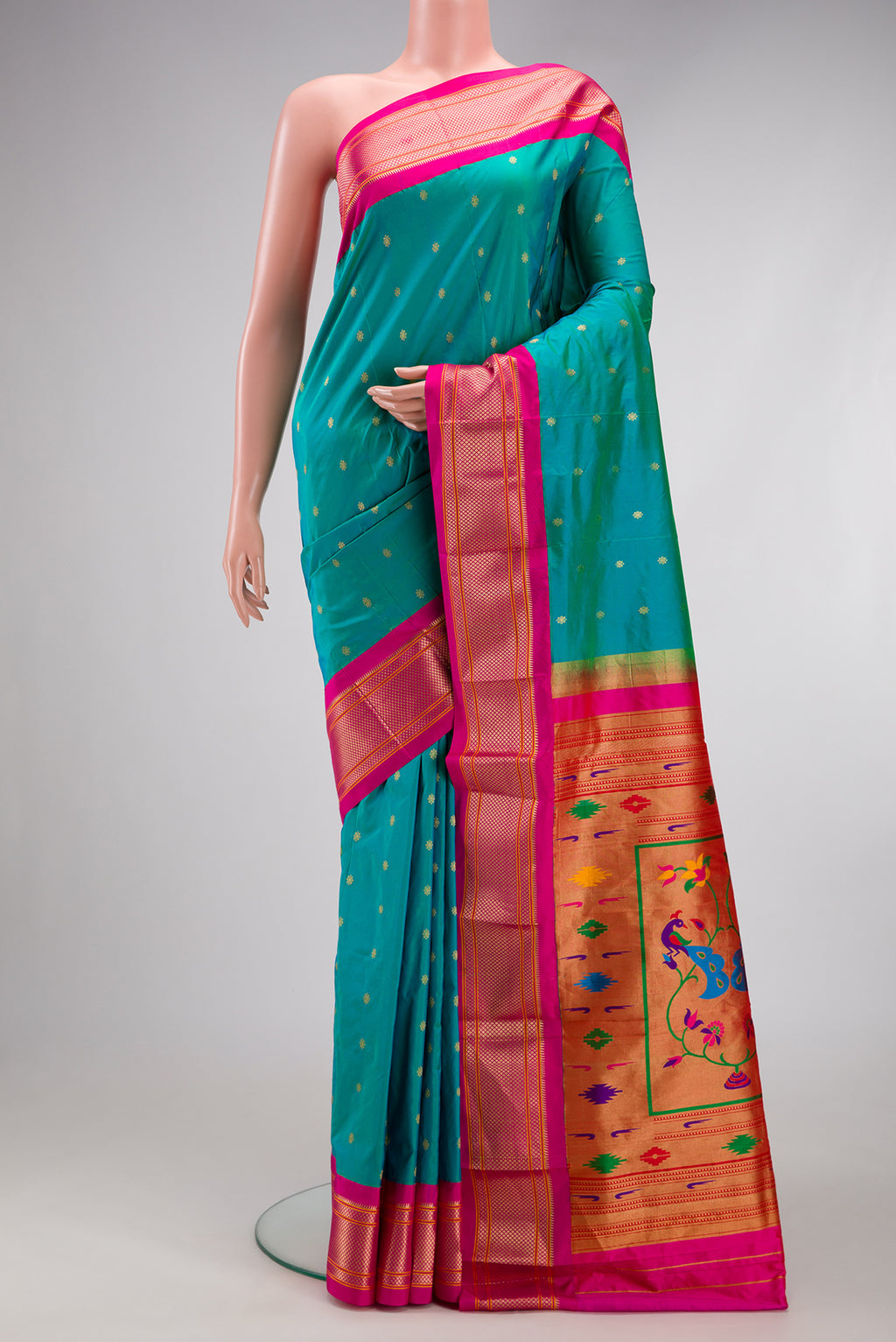 Sea Green Paithani Silk Saree with Zari Butta on the body and Zari Border.  displayed on a mannequin