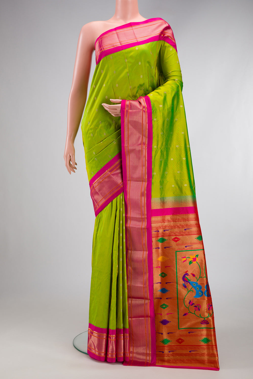 Parrot Green Paithani Silk Saree with Zari Butta on the body and Zari Border.  displayed on a mannequin