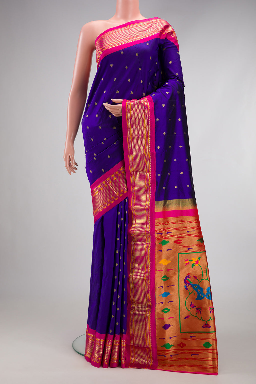 Blue Paithani Silk Saree with Zari Butta on the body and Zari Border.  displayed on a mannequin