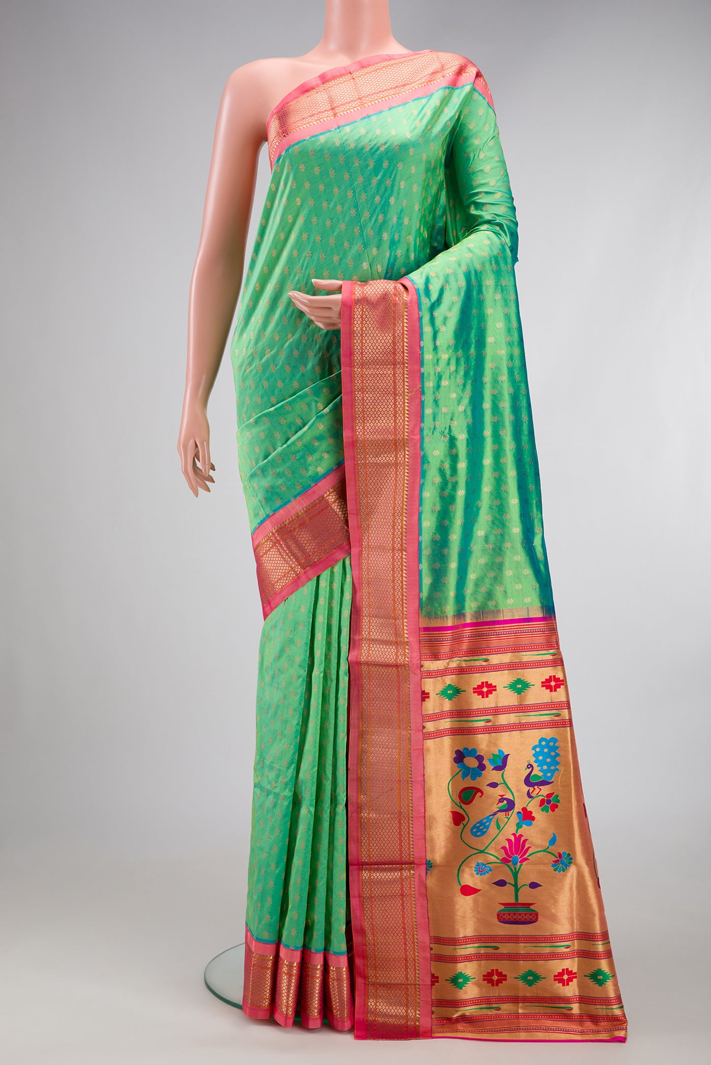 Sea Green Dual Tone Paithani Silk Saree with Zari Butta on the body and Zari Border.  displayed on a mannequin