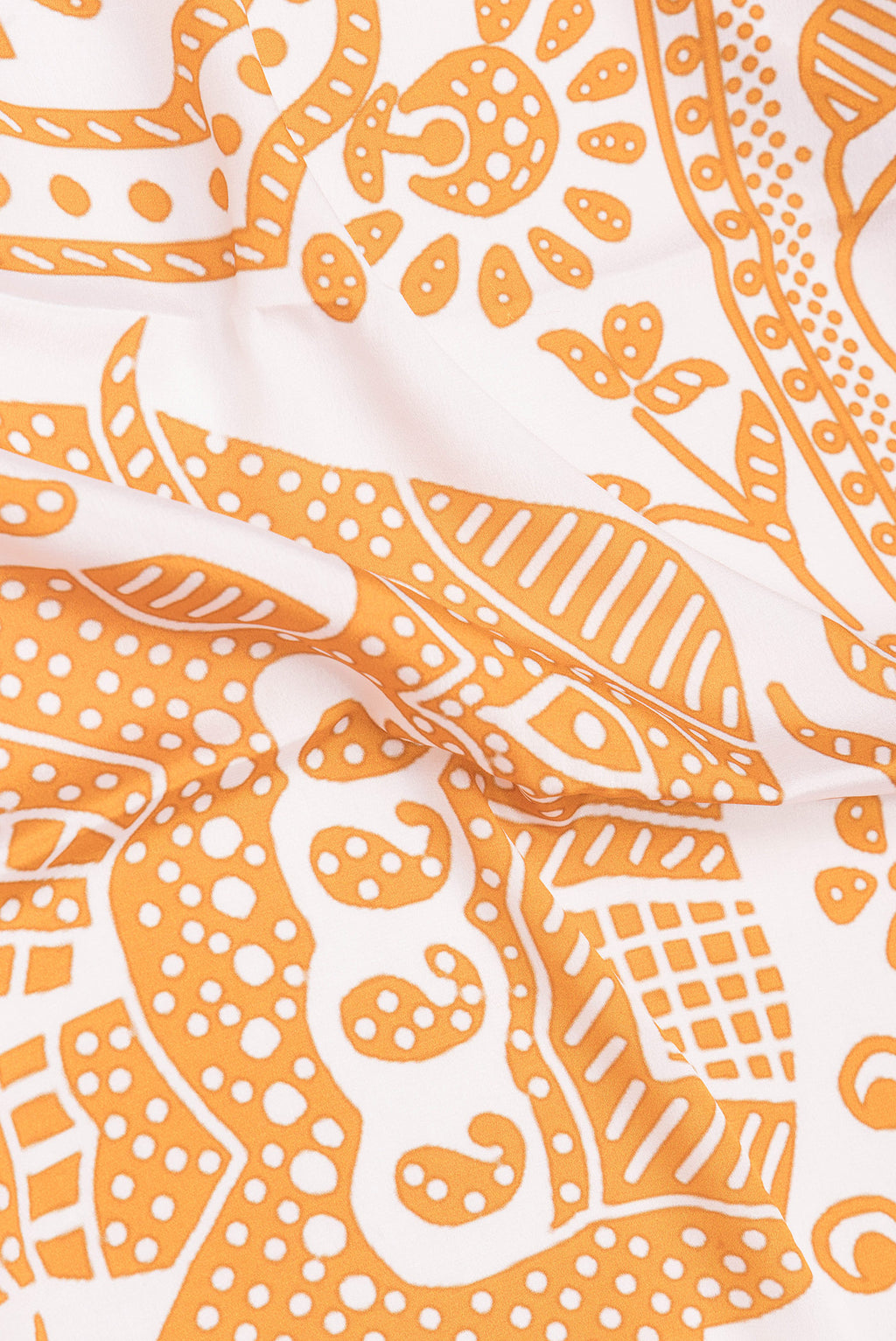 Close up of Pure Silk Off White Mysore Silk Saree with Printed design on the body and Zari Border.  displaying folds