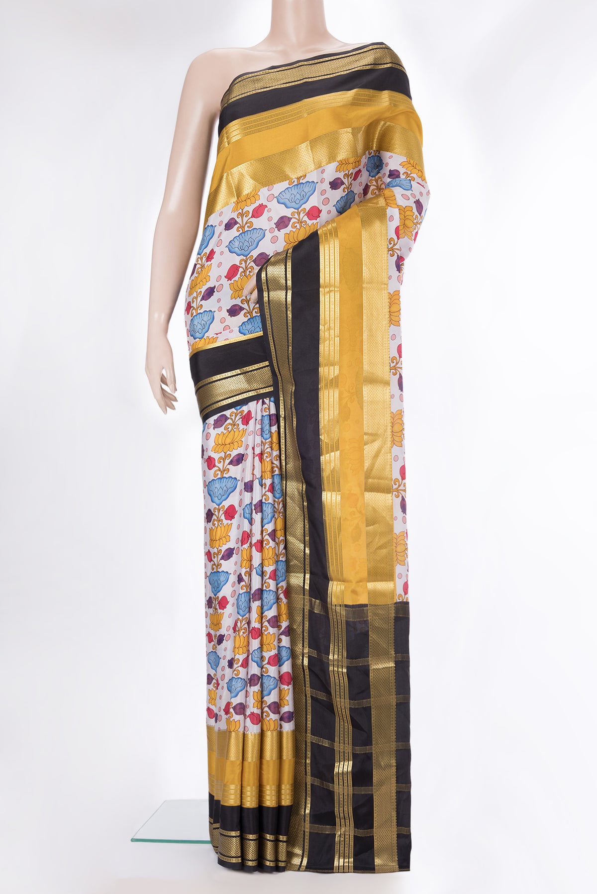 Off White Mysore Crepe Saree with Printed design on the body and Fancy Border.  displayed on a mannequin