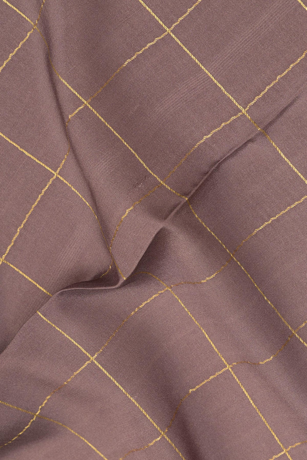 Close up of Pure Silk Brown Mysore Silk Saree with Checked design on the body and Zari Border.  displaying folds