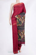 Maroon Tussar Saree with Checked design on the body and Zari Border.  displayed on a mannequin
