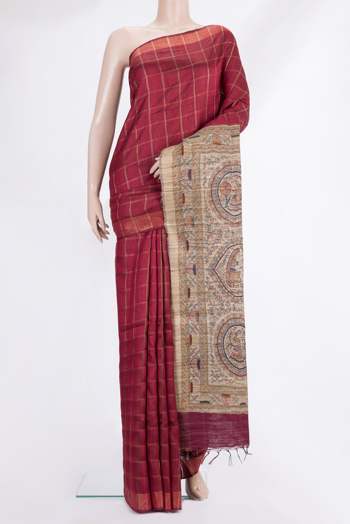 Maroon Tussar Saree with Checked design on the body and Zari Border.  displayed on a mannequin