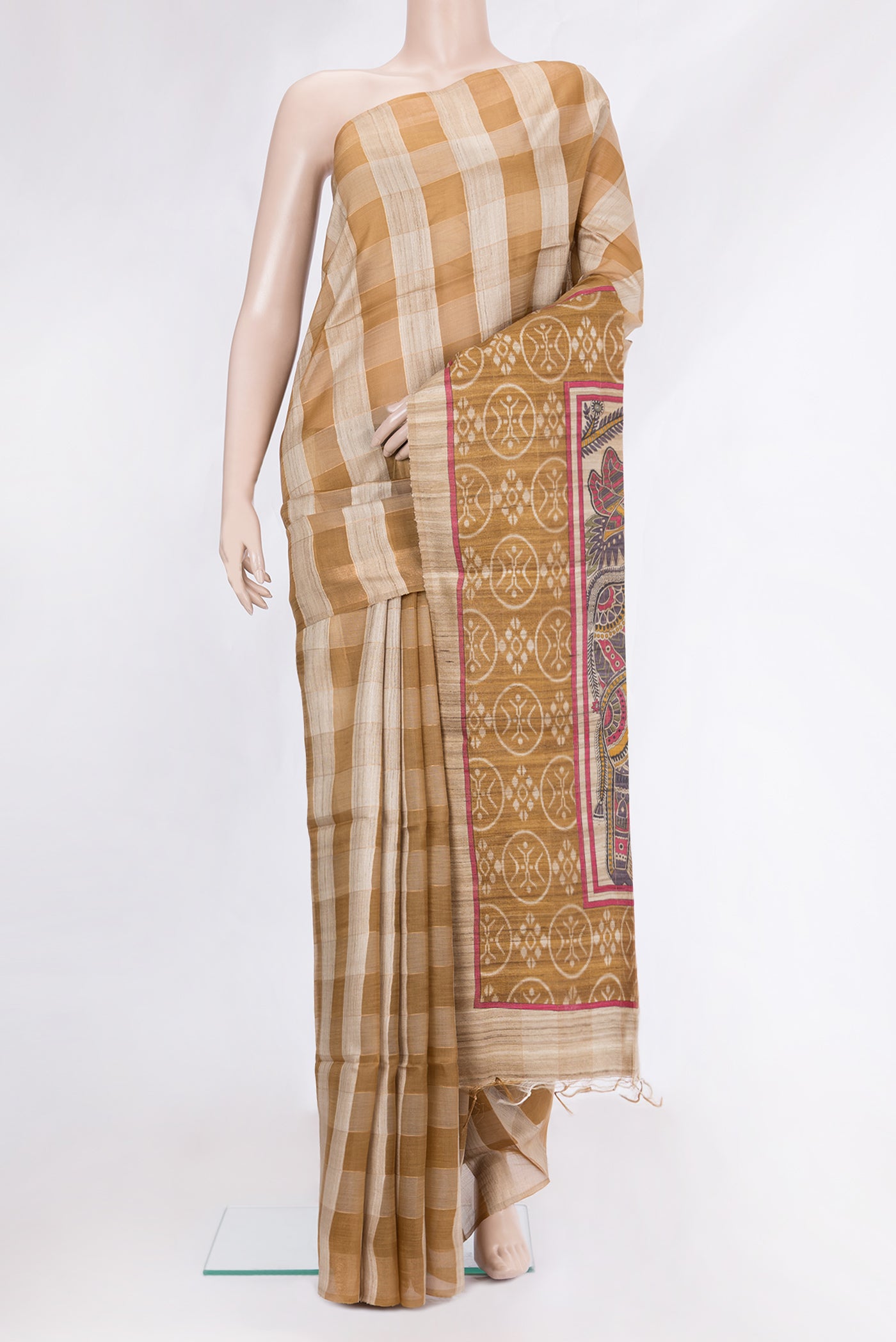Multi Color Tussar Silk Saree with Checked design on the body and Zari Border.  displayed on a mannequin