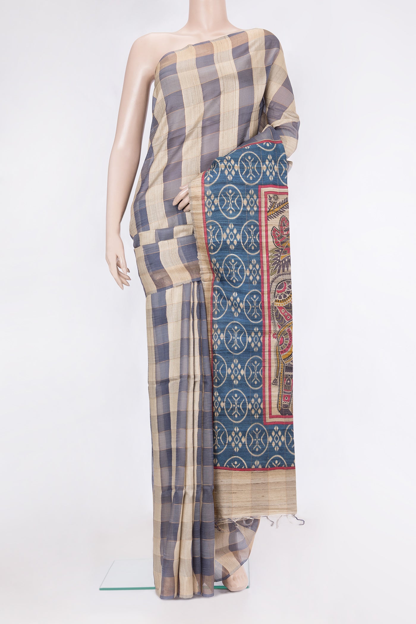 Multi Color Tussar Silk Saree with Checked design on the body and Zari Border.  displayed on a mannequin