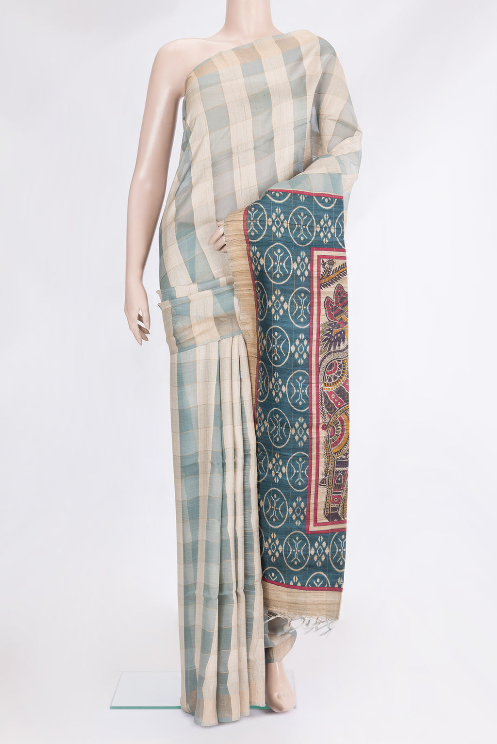 Multi Color Tussar Silk Saree with Checked design on the body and Zari Border.  displayed on a mannequin