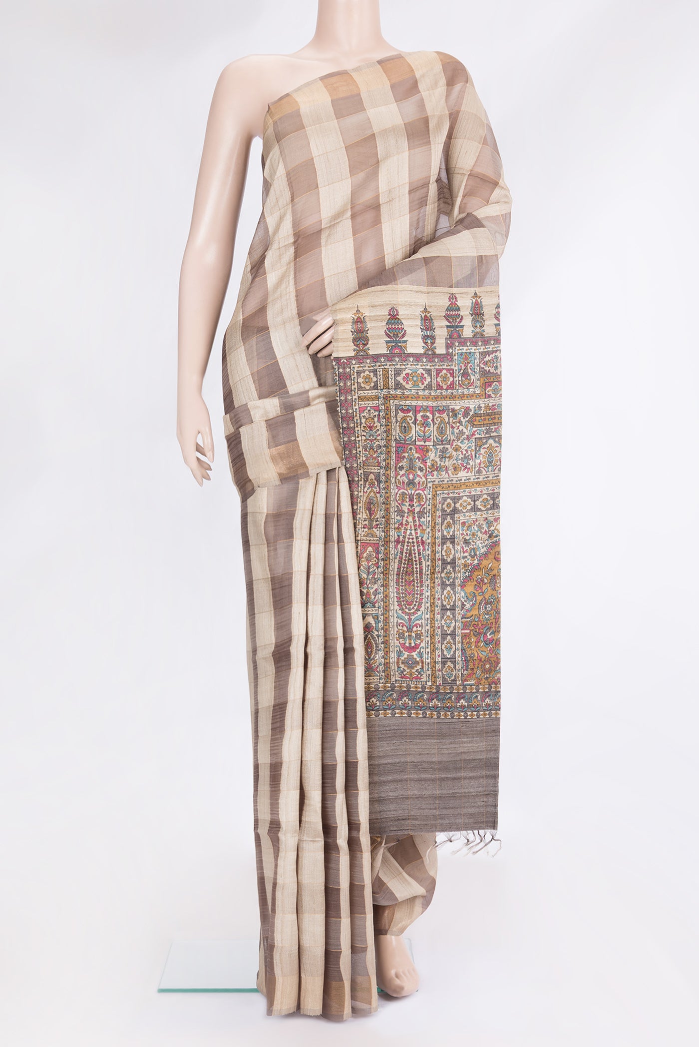 Multi Color Tussar Silk Saree with Checked design on the body and Zari Border.  displayed on a mannequin
