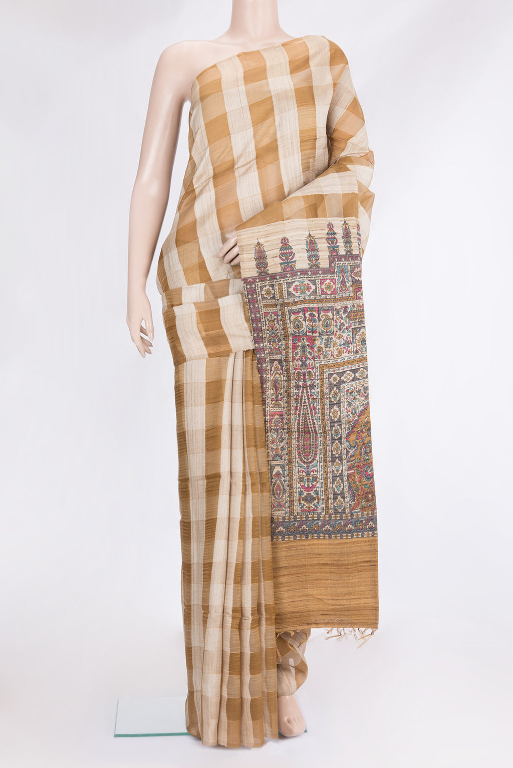 Gold and Brown Color Tussar Silk Saree with Checked design on the body and Zari Border.  displayed on a mannequin