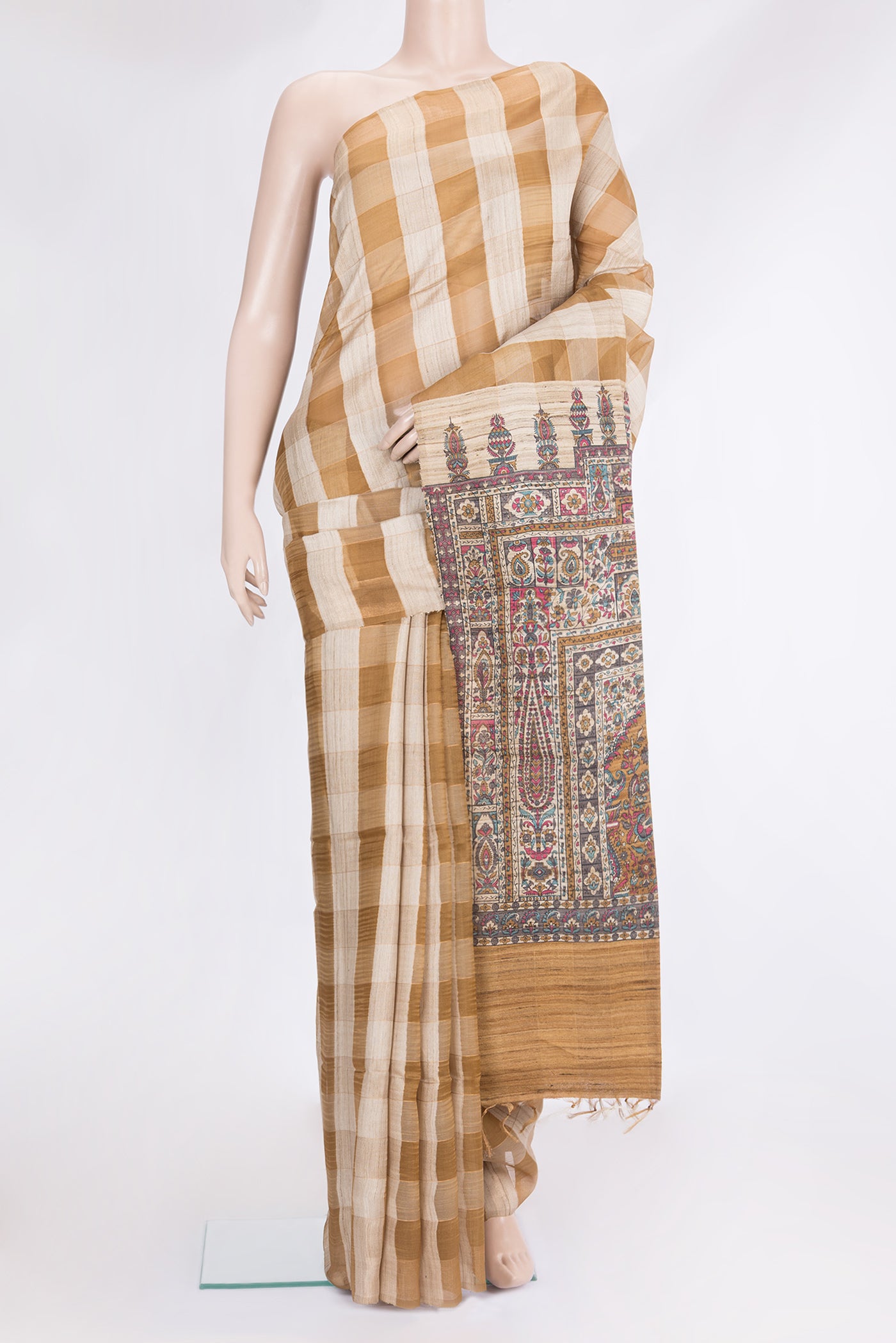 Gold and Brown Color Tussar Silk Saree with Checked design on the body and Zari Border.  displayed on a mannequin