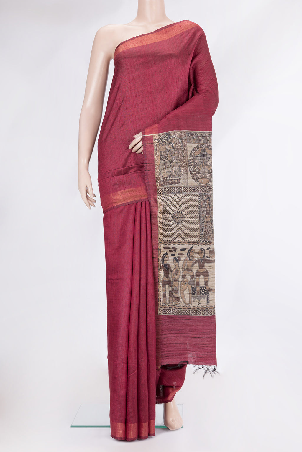 Maroon Tussar Silk Saree with Plain Body and Zari Border.  displayed on a mannequin