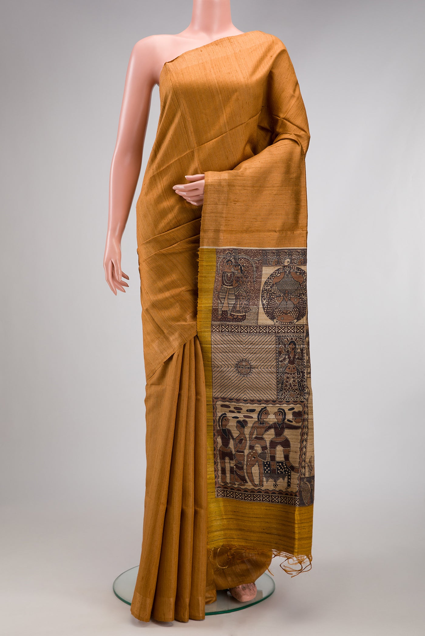 Mustard Tussar Silk Saree with Plain Body and Zari Border.  displayed on a mannequin