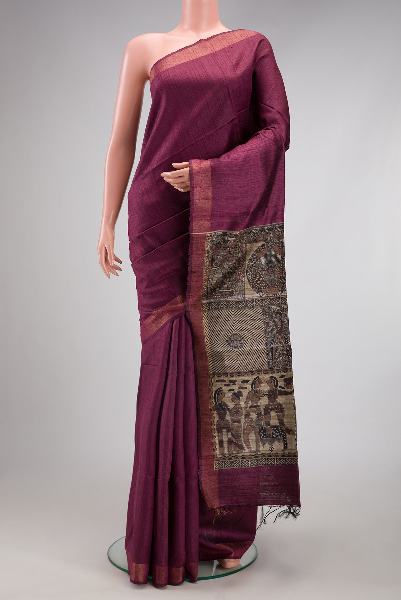 Magenta Tussar Silk Saree with Plain Body and Zari Border.  displayed on a mannequin