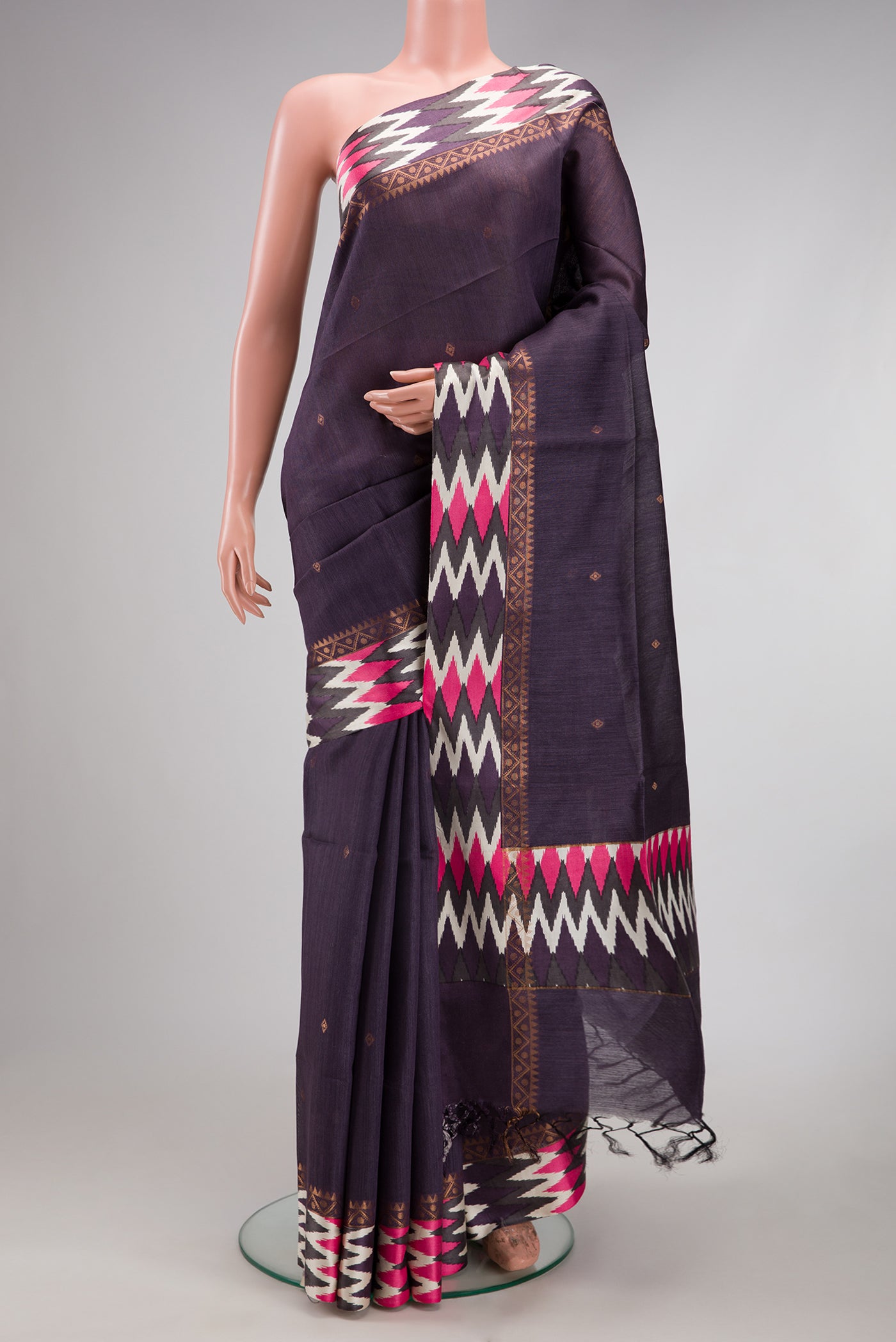 Purple Tussar Silk Saree with Zari Butta on the body and Printed Border.  displayed on a mannequin