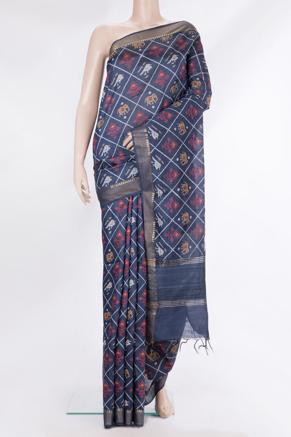 Blue Tussar Saree with Printed design on the body and Zari Border.  displayed on a mannequin