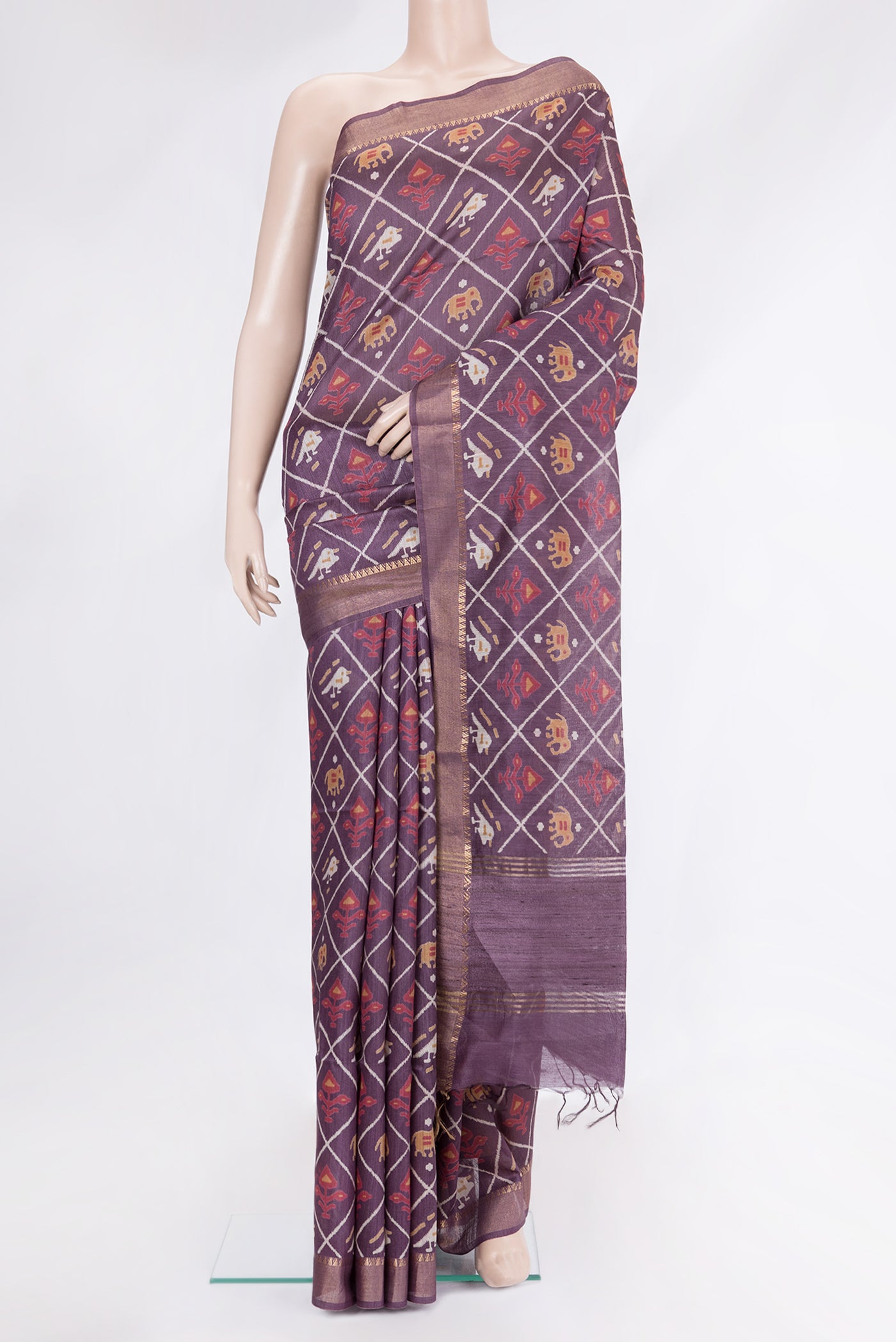 Purple Tussar Silk Saree with Printed design on the body and Plain Border.  displayed on a mannequin