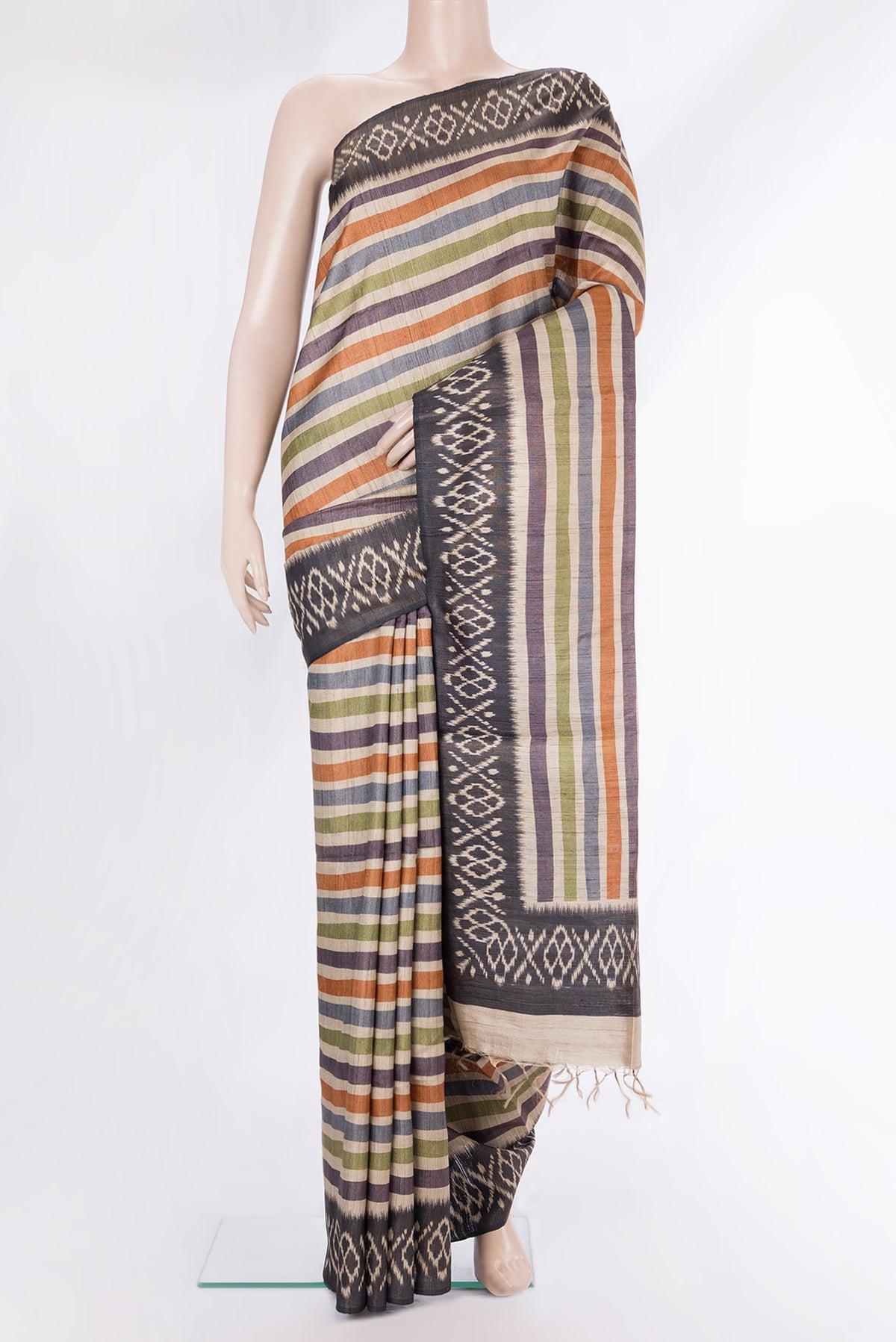 Pure Silk Beige Tussar Saree with Stripes on the body and Ikat Border.  displayed on a mannequin