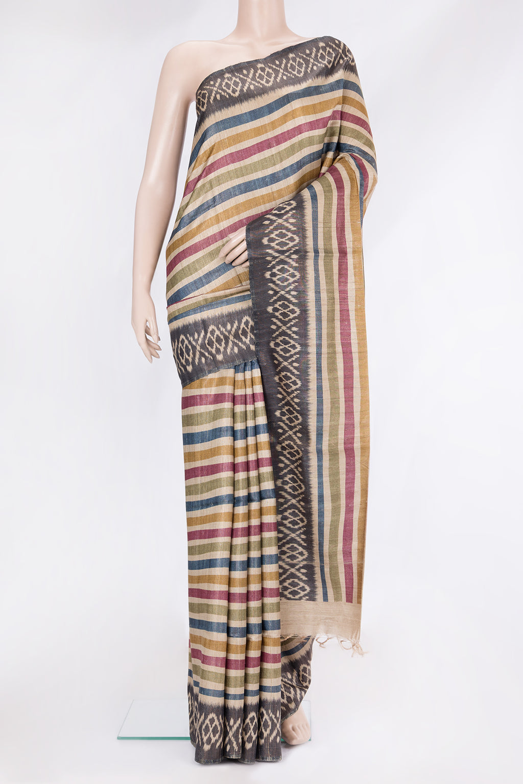 Multi Color Tussar Silk Saree with Stripes on the body and Ikat Border.  displayed on a mannequin