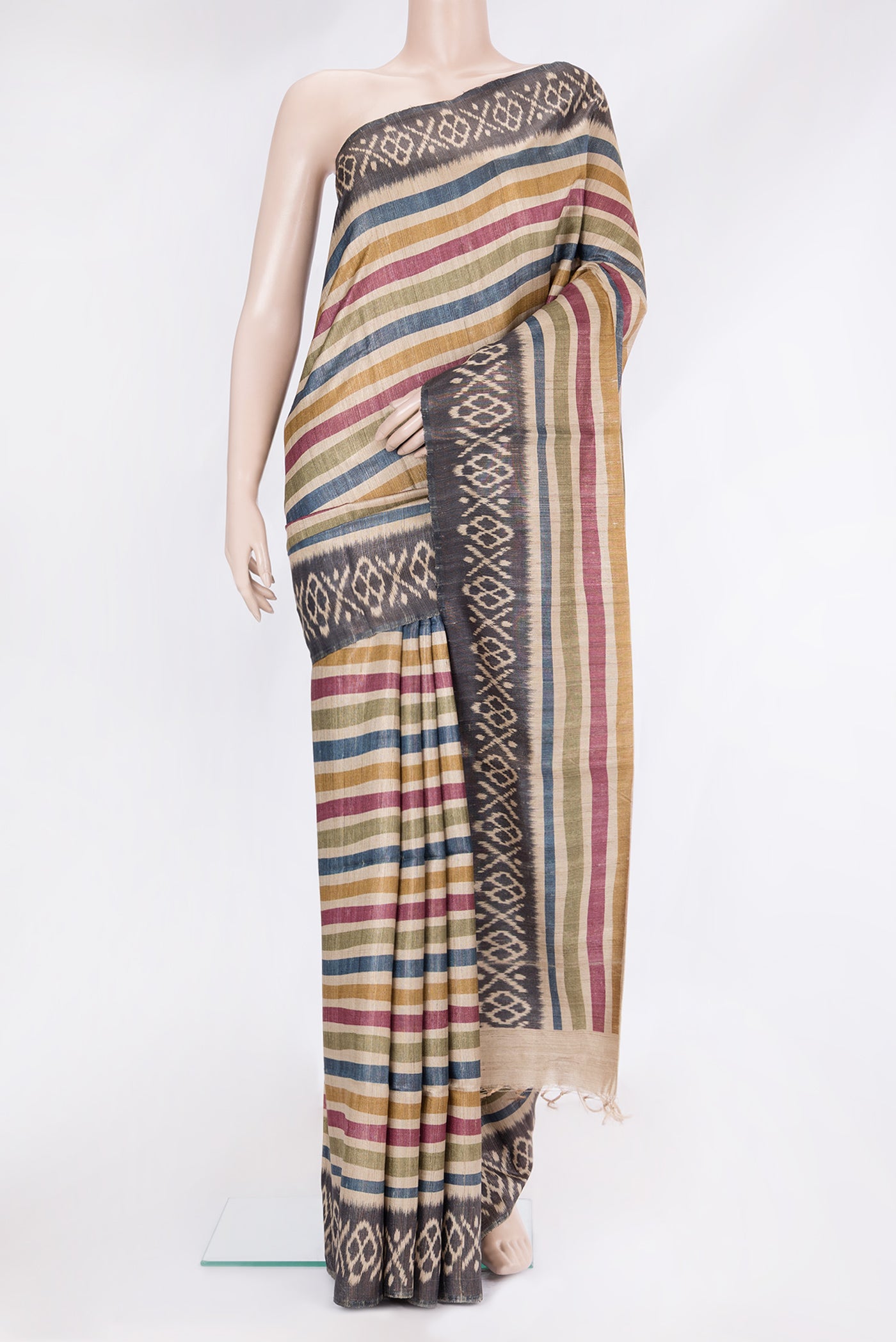 Multi Color Tussar Silk Saree with Stripes on the body and Ikat Border.  displayed on a mannequin