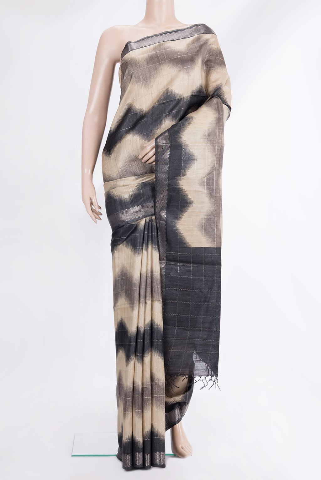 Beige Tussar Saree with Stripes on the body and Zari Border.  displayed on a mannequin