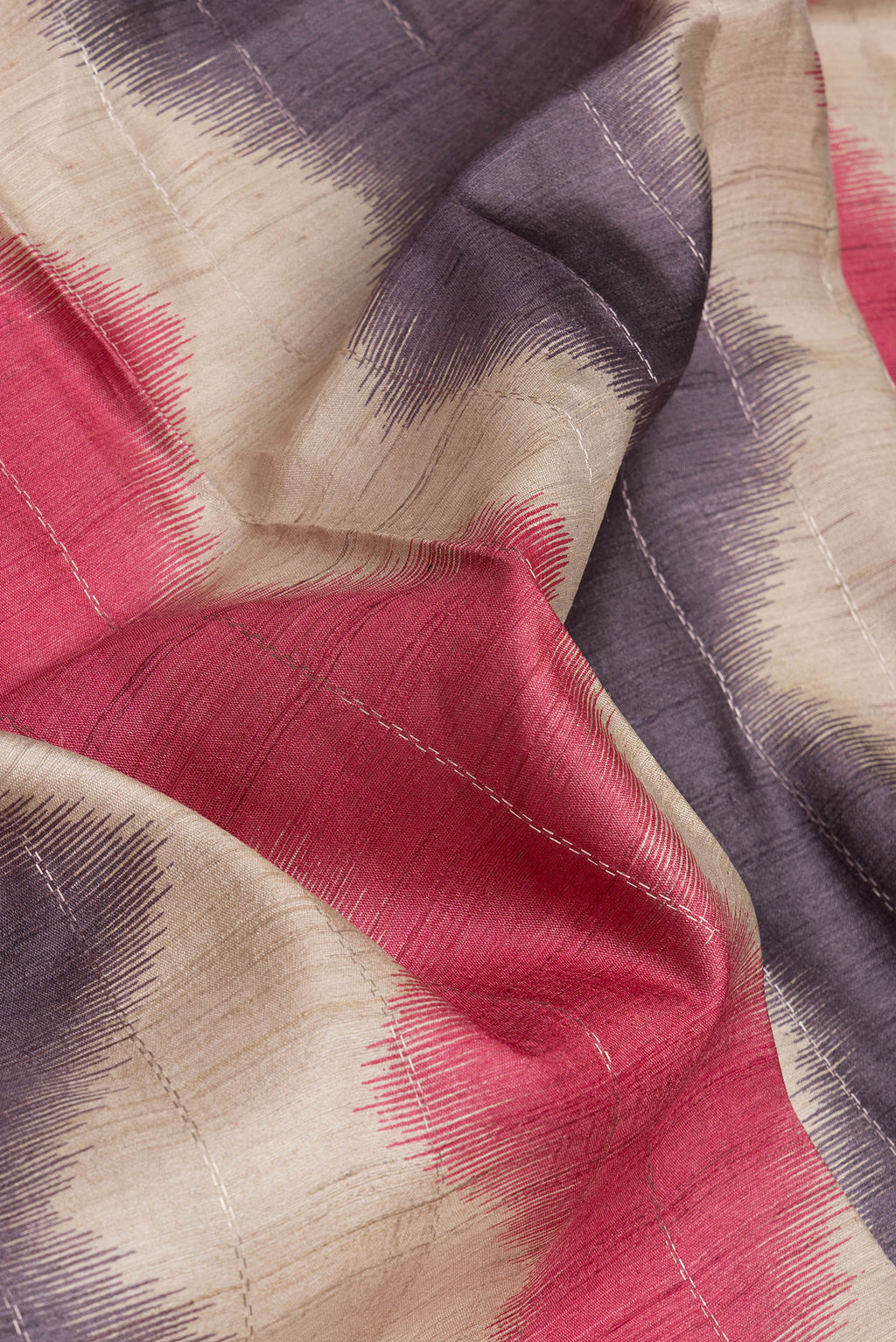Close up of Beige Tussar Silk Saree with Stripes on the body and Zari Border.  displaying folds
