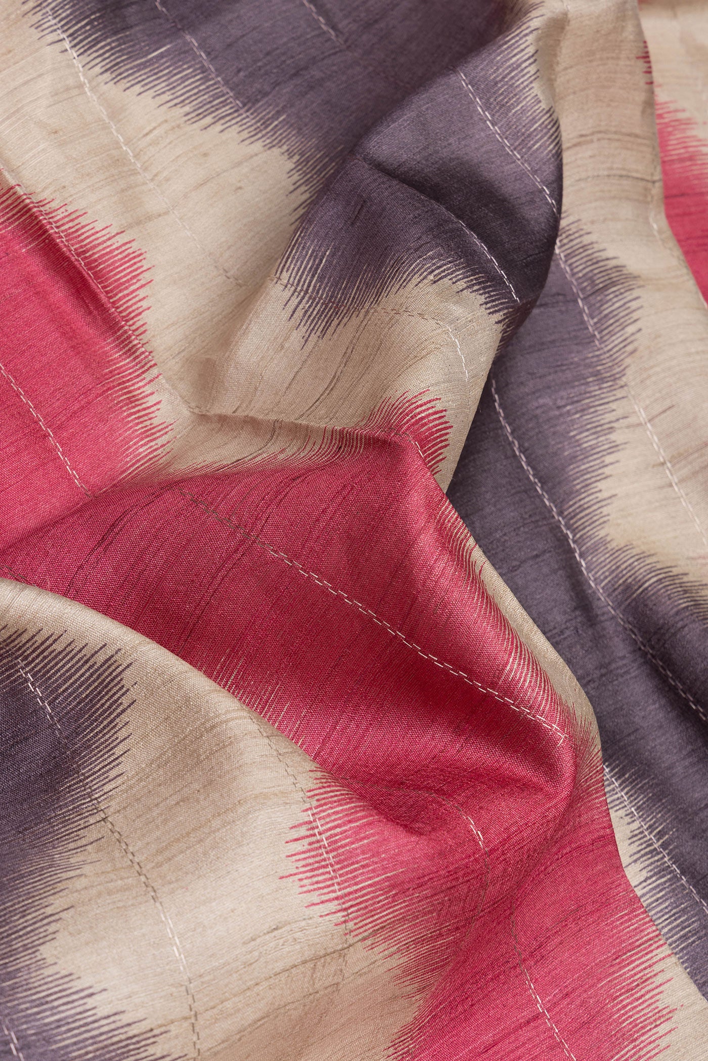 Close up of Beige Tussar Silk Saree with Stripes on the body and Zari Border.  displaying folds