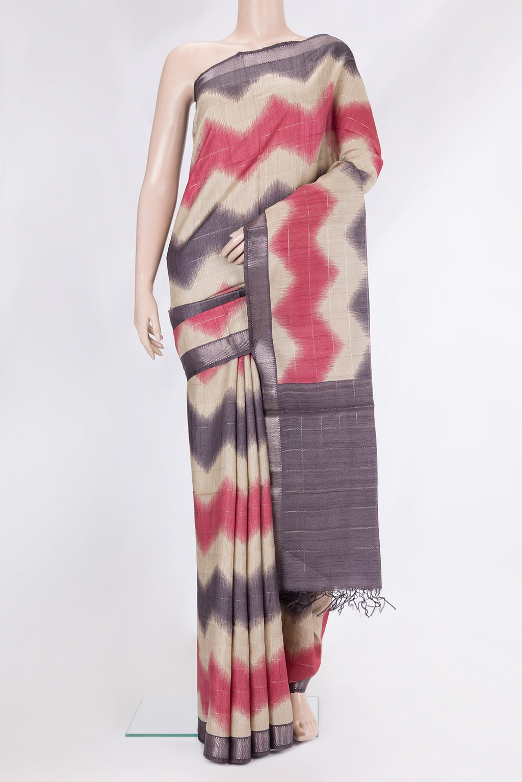Beige Tussar Silk Saree with Stripes on the body and Zari Border.  displayed on a mannequin