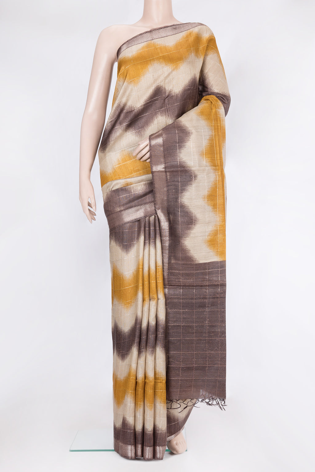 Multi Color Tussar Silk Saree with Printed design on the body and Zari Border.  displayed on a mannequin