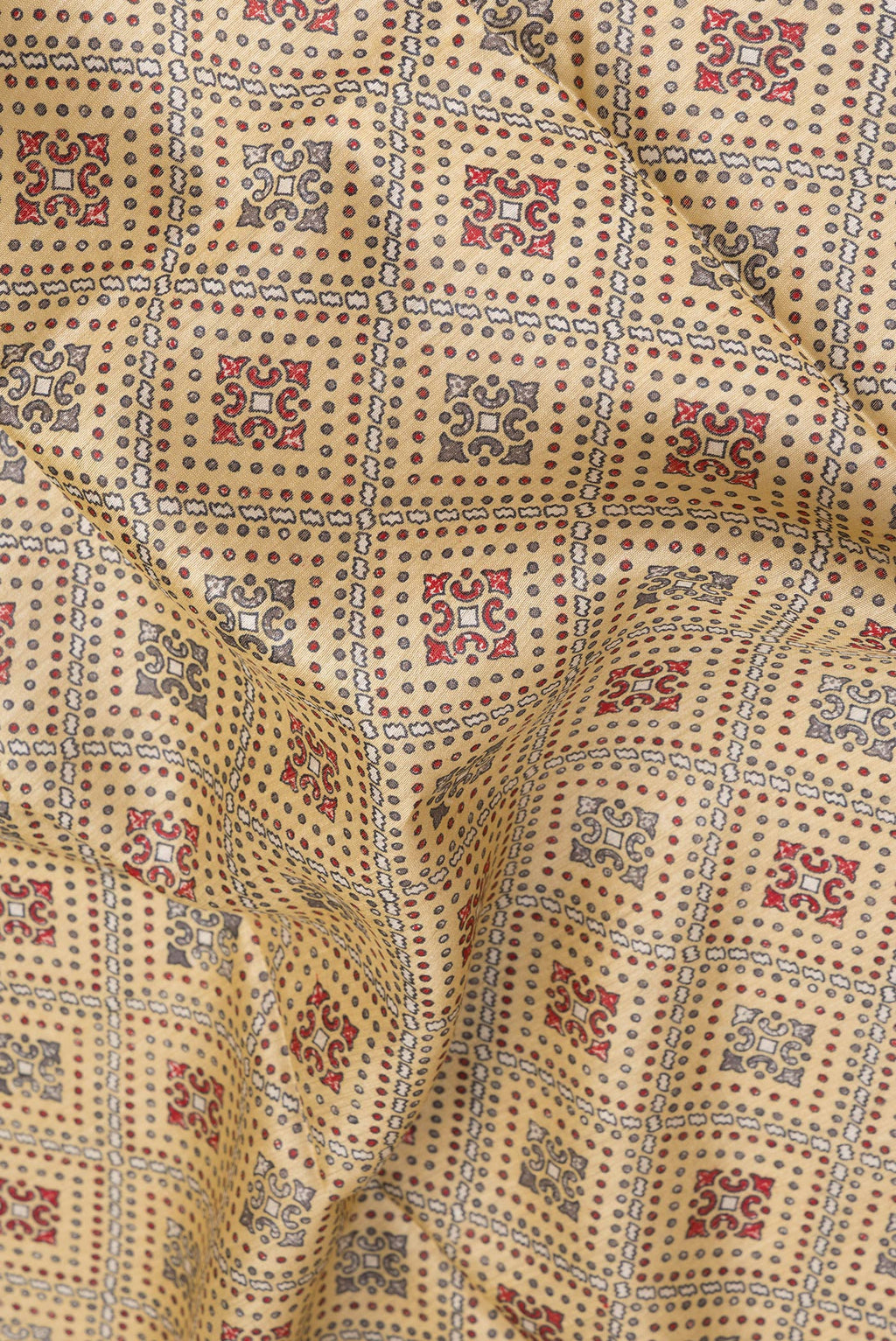 Close up of Sandal Tussar Silk Saree with Printed design on the body and Fancy Border.  displaying folds
