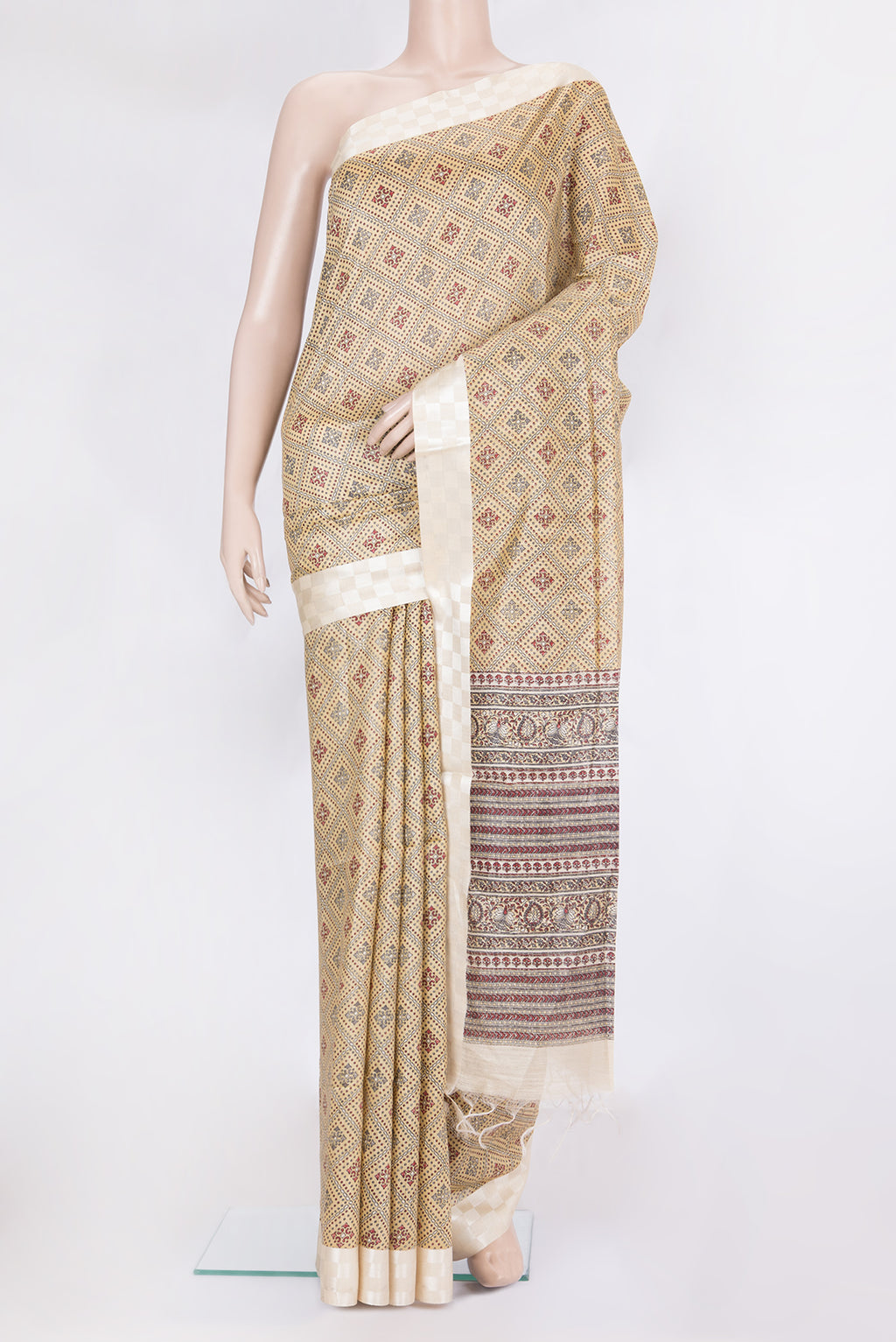 Sandal Tussar Silk Saree with Printed design on the body and Fancy Border.  displayed on a mannequin