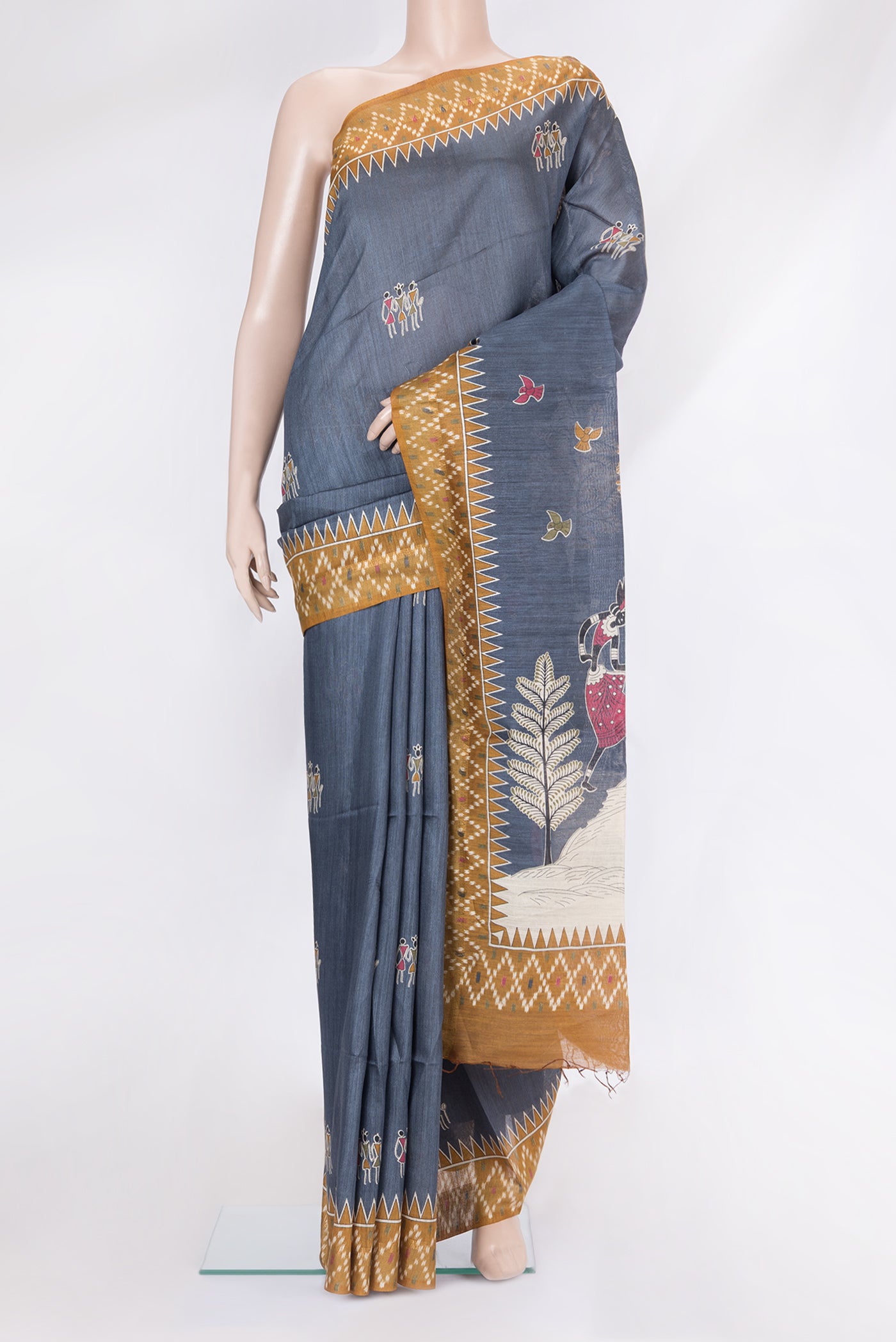 Grey Tussar Silk Saree with Printed design on the body and Printed Border.  displayed on a mannequin