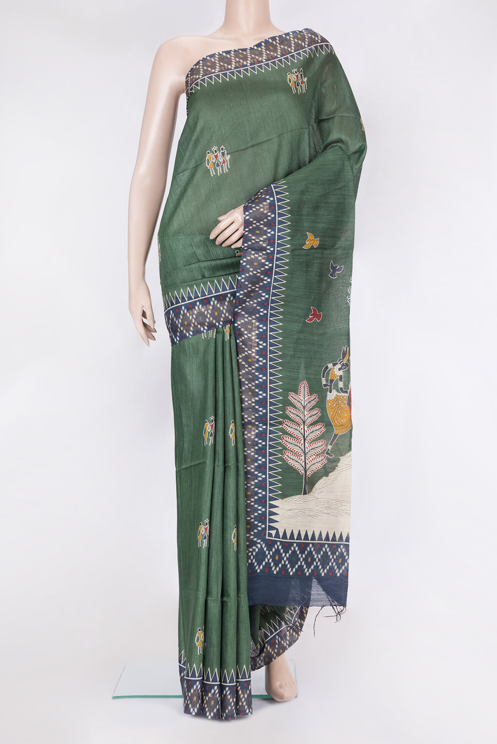 Green Tussar Silk Saree with Printed design on the body and Temple Border.  displayed on a mannequin