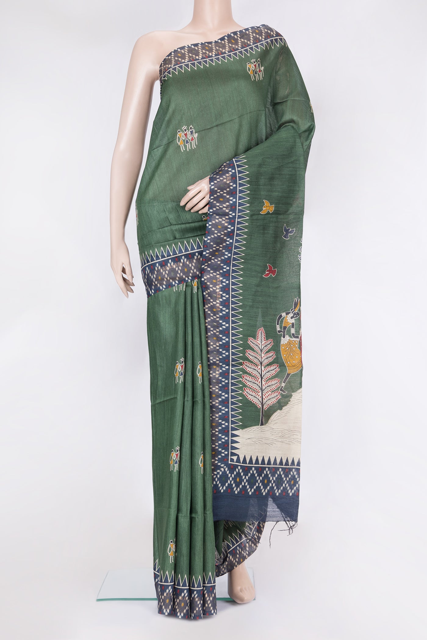 Green Tussar Silk Saree with Printed design on the body and Temple Border.  displayed on a mannequin