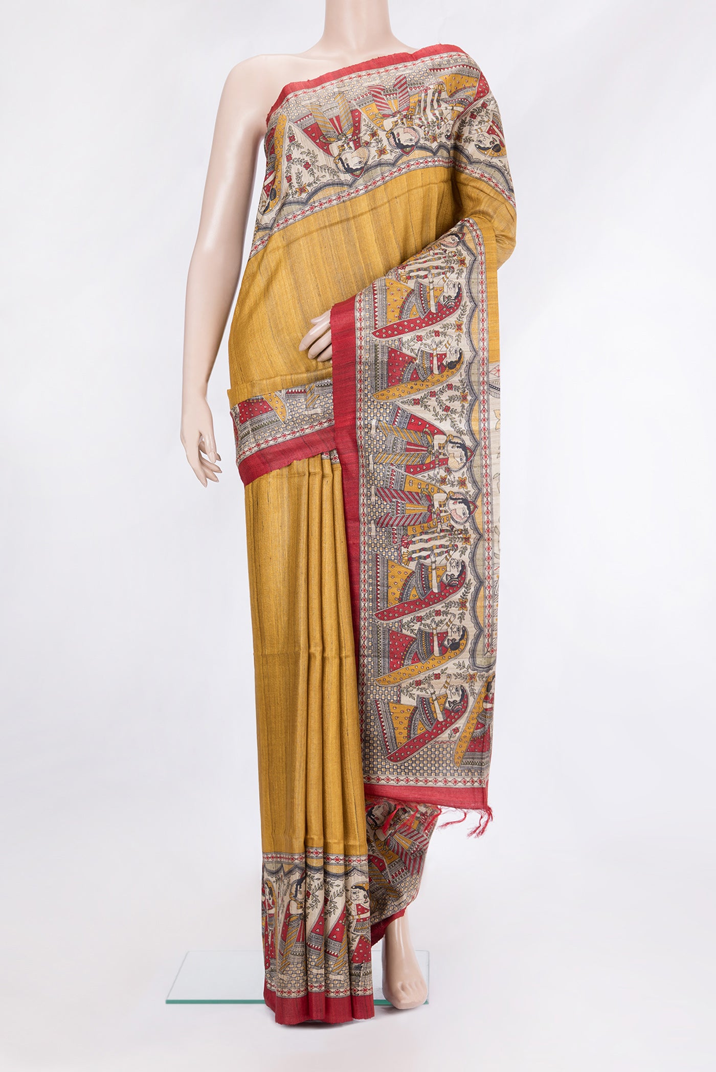 Mustard Tussar Silk Saree with Plain Body and Printed Border.  displayed on a mannequin