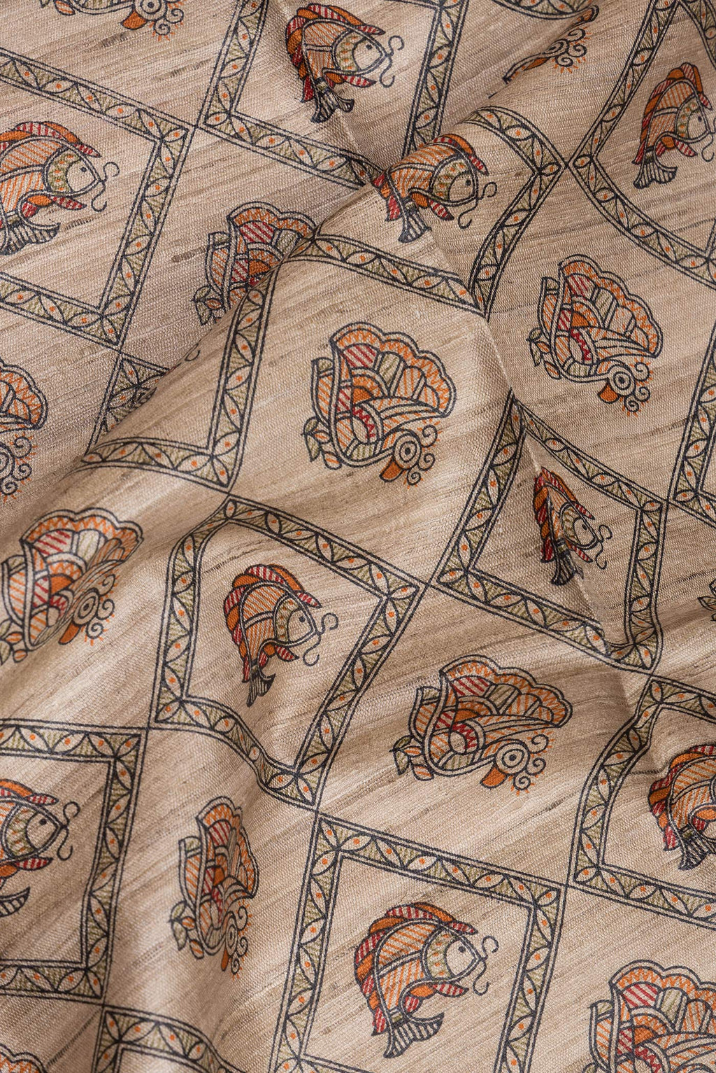 Close up of Beige Tussar Saree with Printed design on the body and Printed Border.  displaying folds