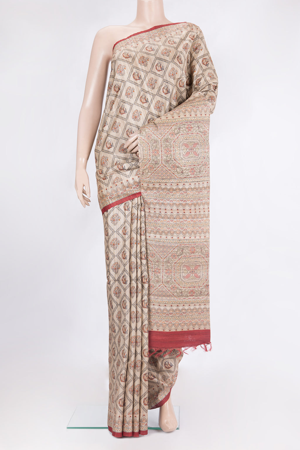 Beige Tussar Saree with Printed design on the body and Printed Border.  displayed on a mannequin