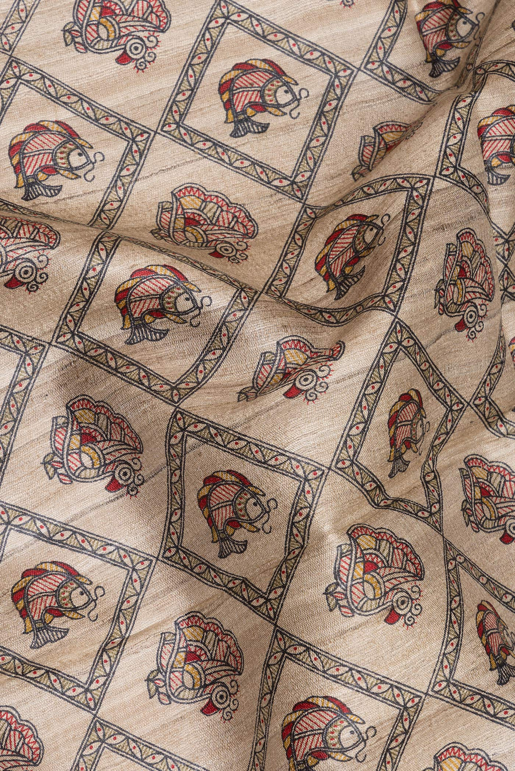 Close up of Beige Tussar Saree with Printed design on the body and Printed Border.  displaying folds