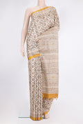 Beige Tussar Saree with Printed design on the body and Printed Border.  displayed on a mannequin
