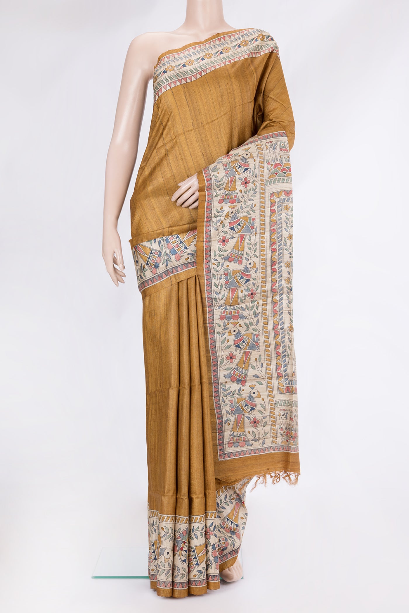Mustard Tussar Silk Saree with Plain Body and Fancy Border.  displayed on a mannequin