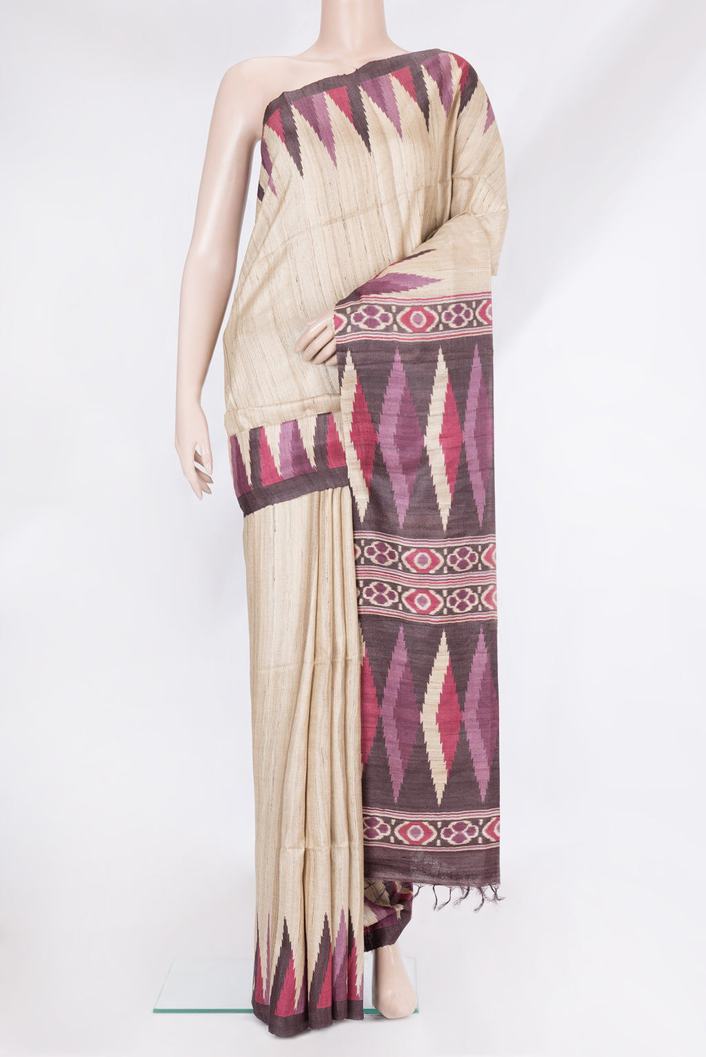 Beige Tussar Silk Saree with Plain Body and Temple Border.  displayed on a mannequin