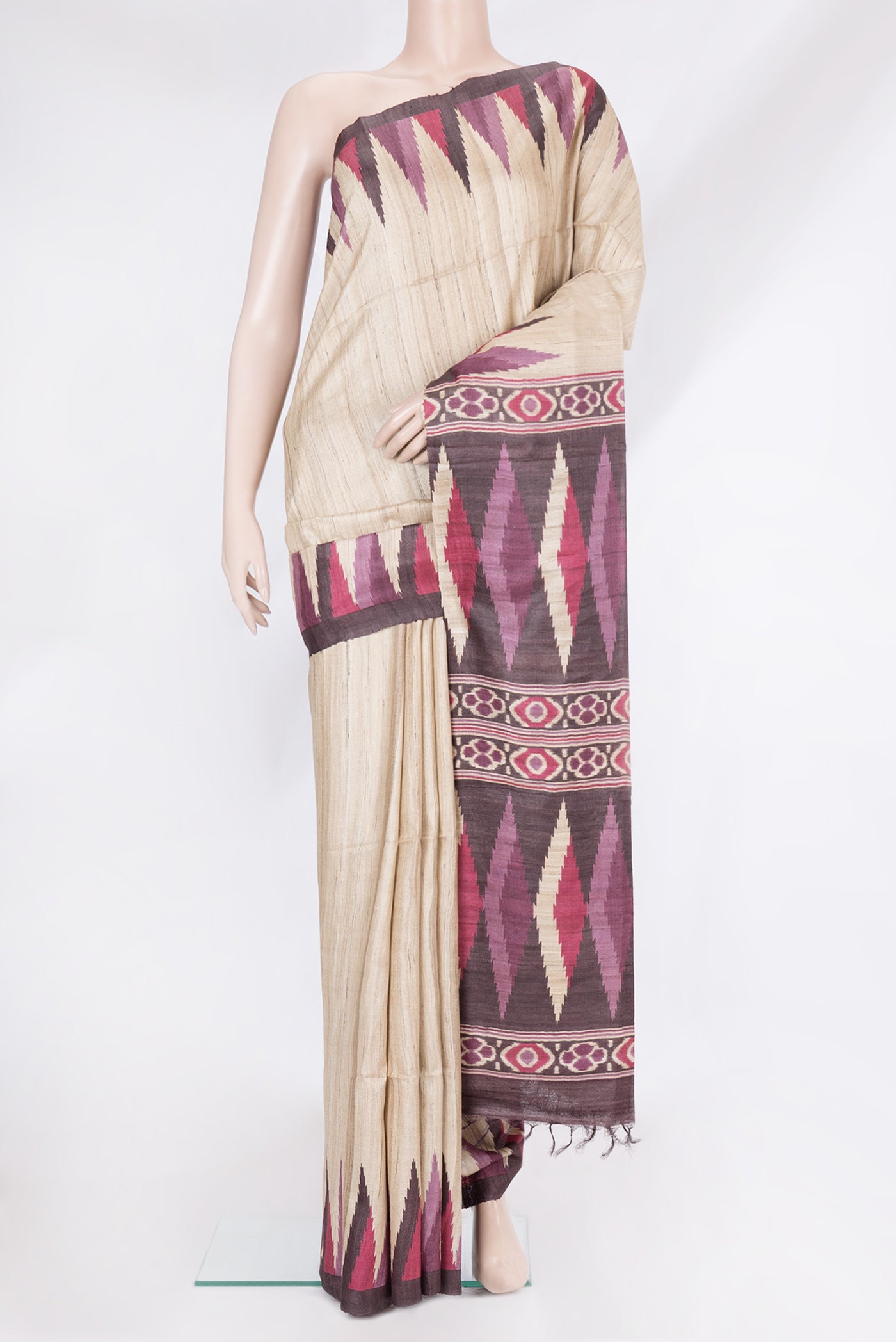 Beige Tussar Silk Saree with Plain Body and Temple Border.  displayed on a mannequin
