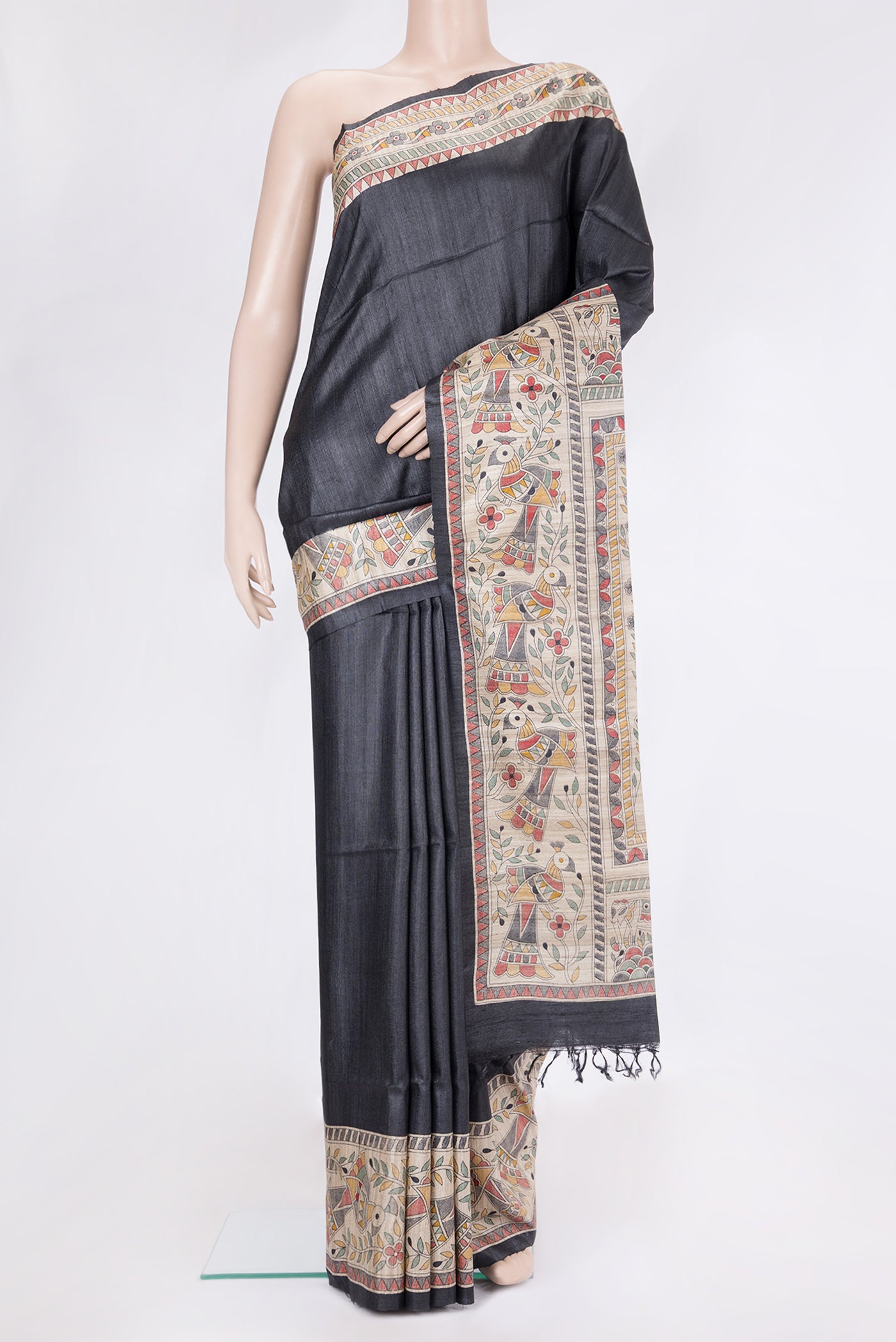 Black Tussar Silk Saree with Plain Body and Fancy Border.  displayed on a mannequin