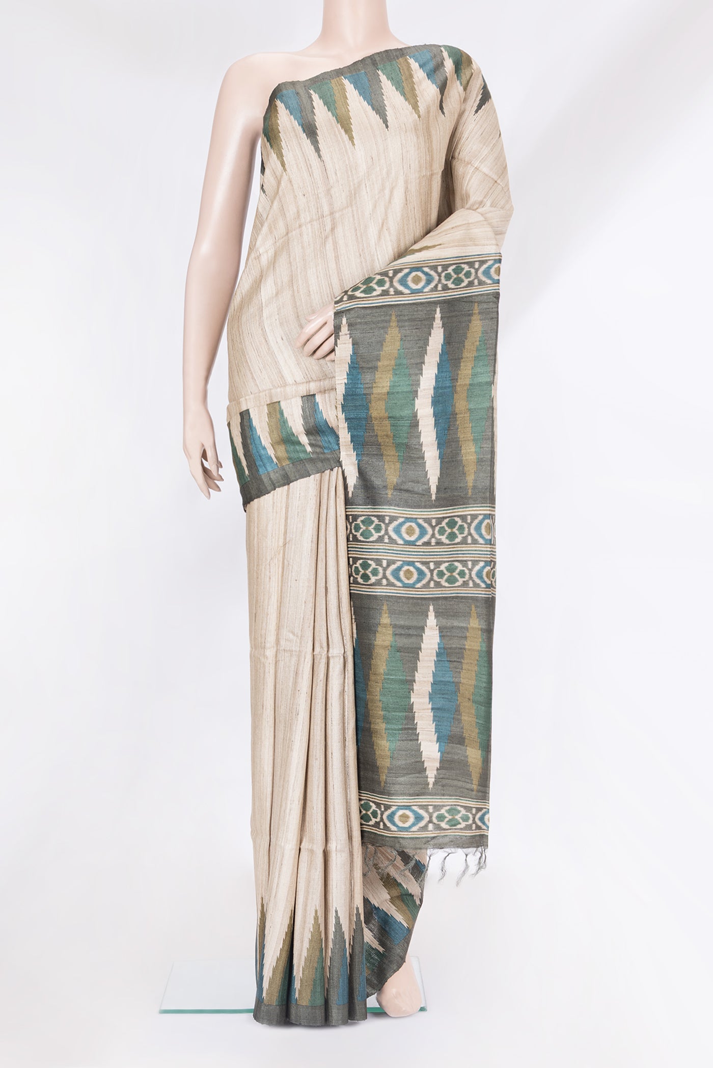 Beige Tussar Silk Saree with Plain Body and Temple Border.  displayed on a mannequin