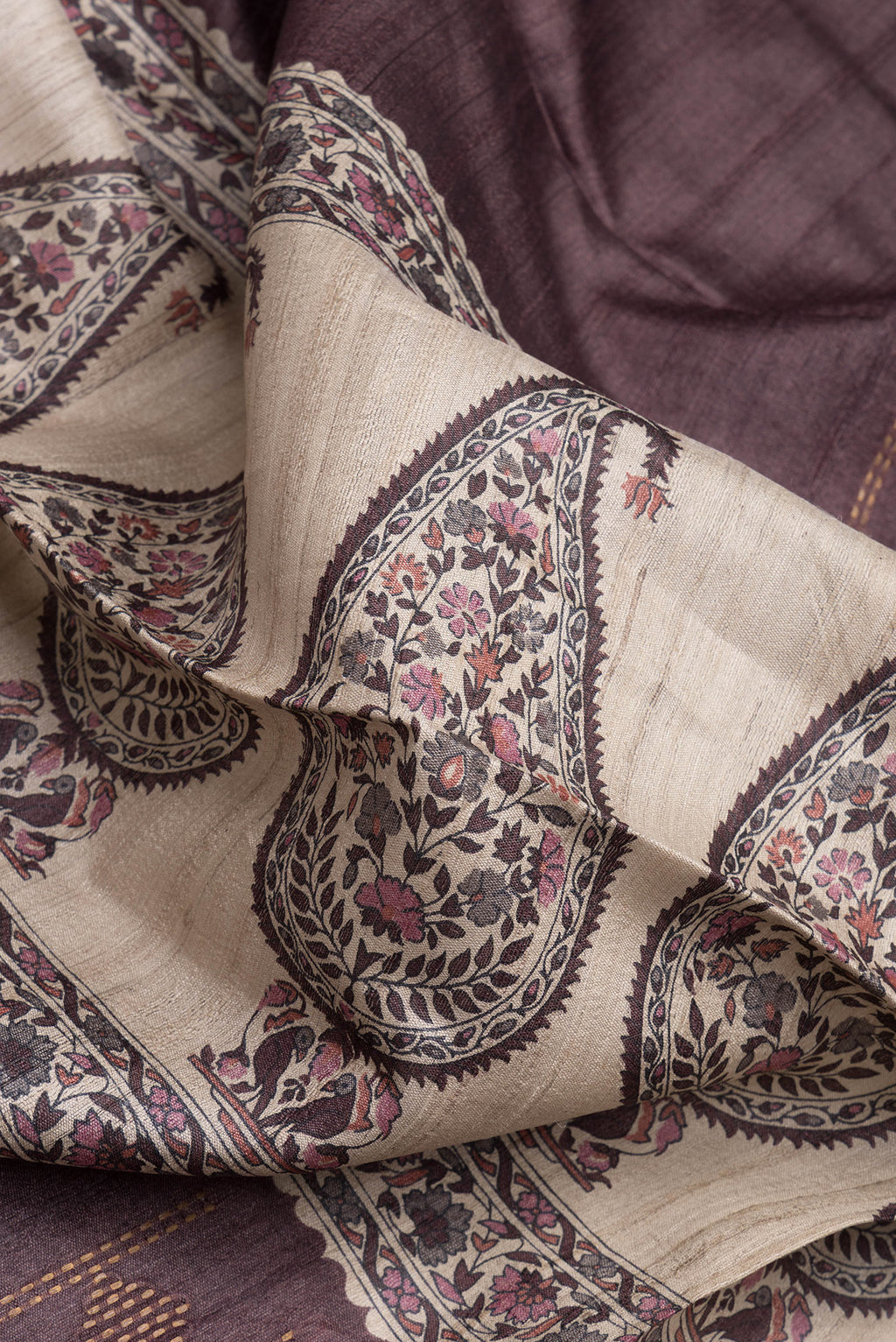 Close up of Brown Tussar Silk Saree with Stripes on the body and Zari Border.  displaying folds