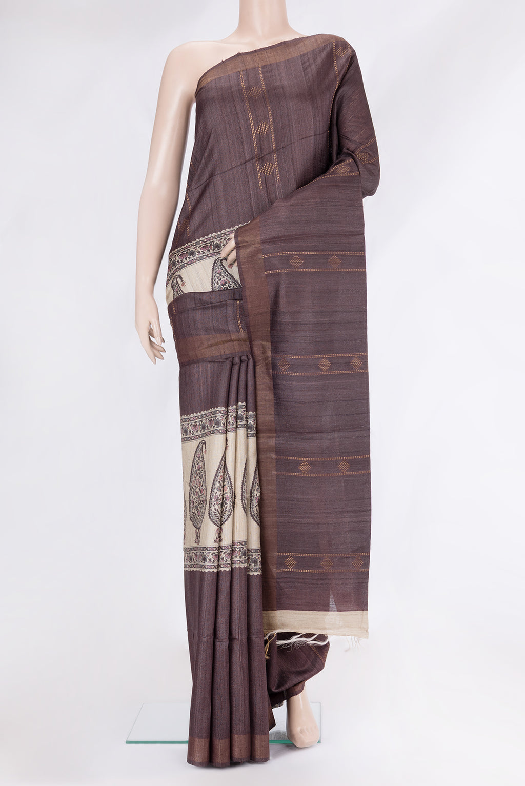 Brown Tussar Silk Saree with Stripes on the body and Zari Border.  displayed on a mannequin
