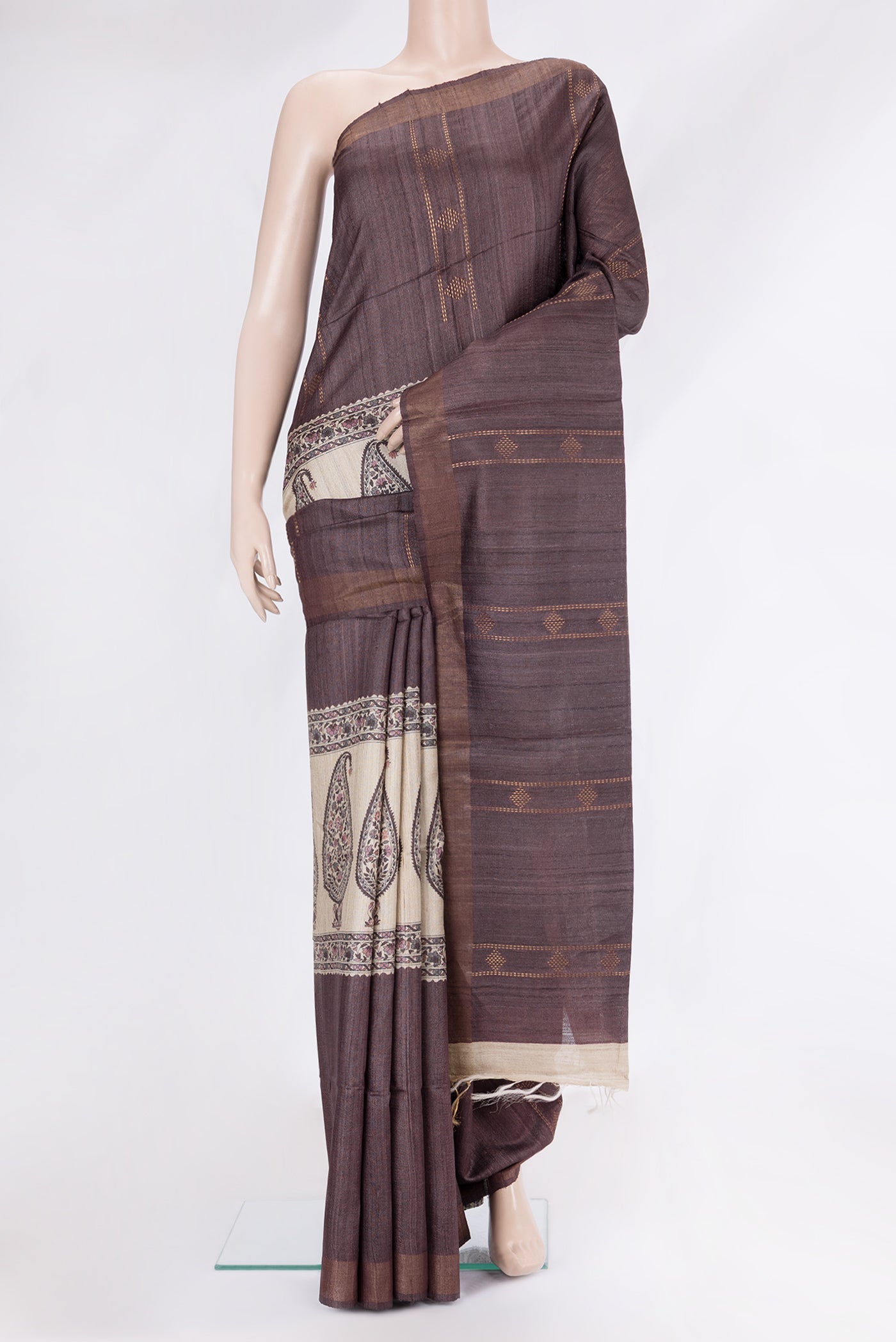 Brown Tussar Silk Saree with Stripes on the body and Zari Border.  displayed on a mannequin