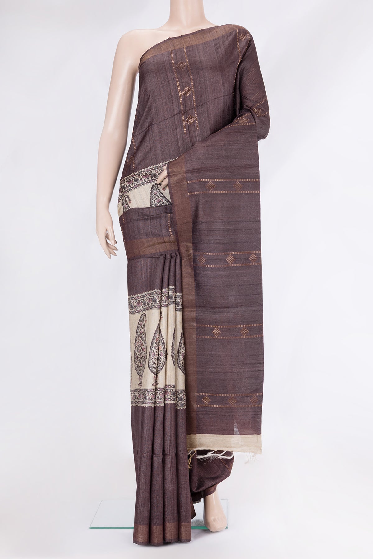 Brown Tussar Silk Saree with Stripes on the body and Zari Border.  displayed on a mannequin